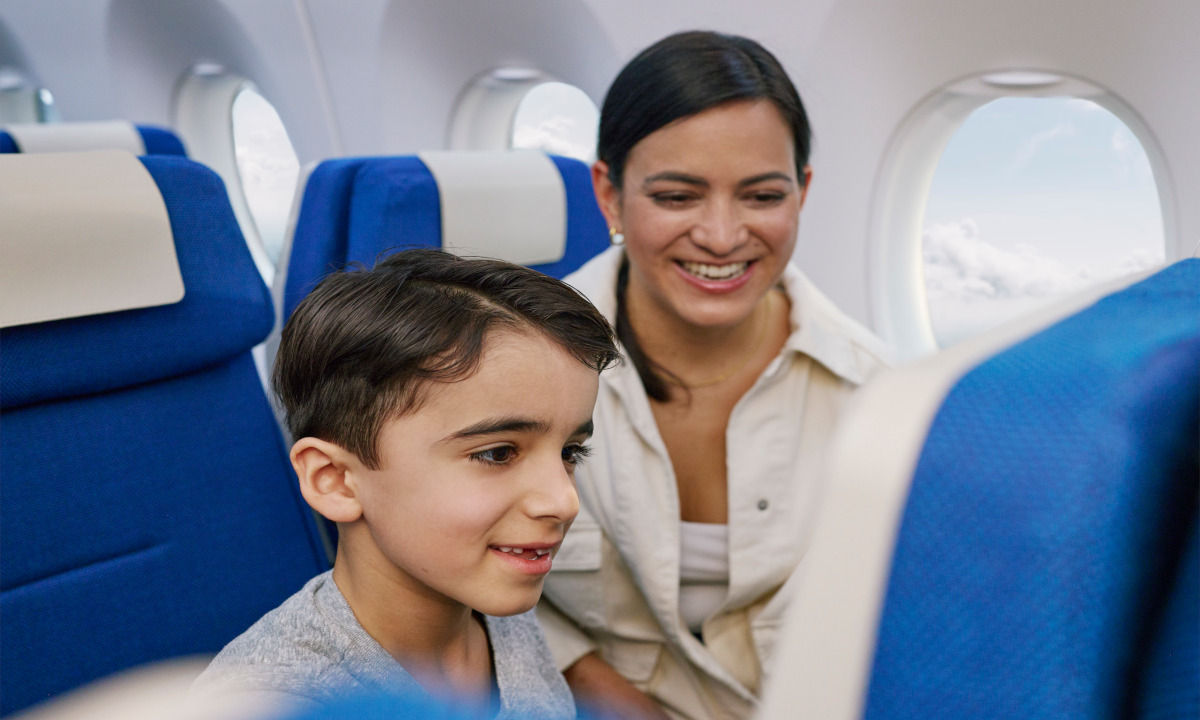 Mother and son in economy seats