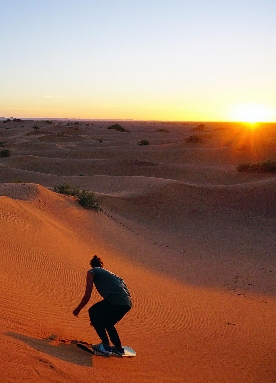 Guy doing sandboarding