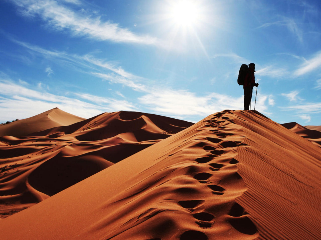 Hiker in sand dunes