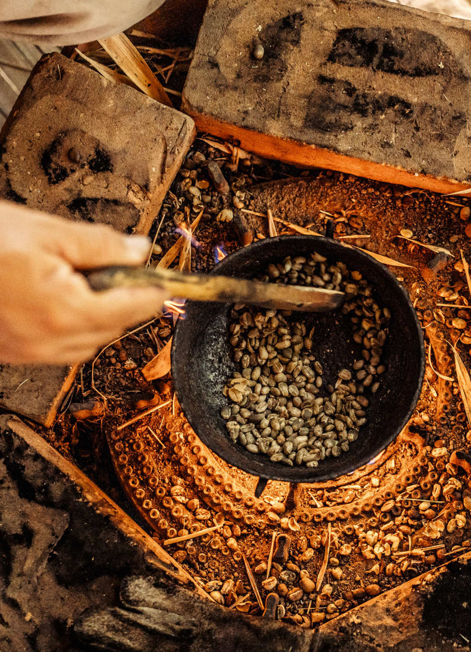 Coffee beans getting roasted over the fire