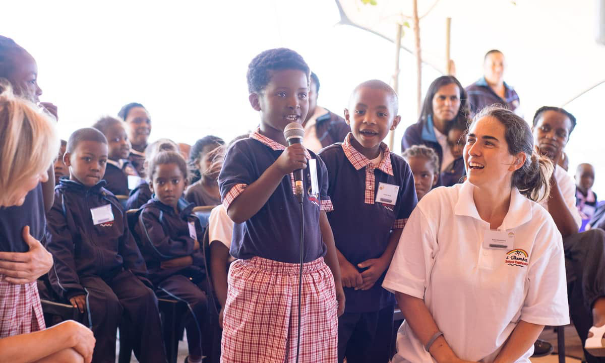 South African boy speaks into the microphone