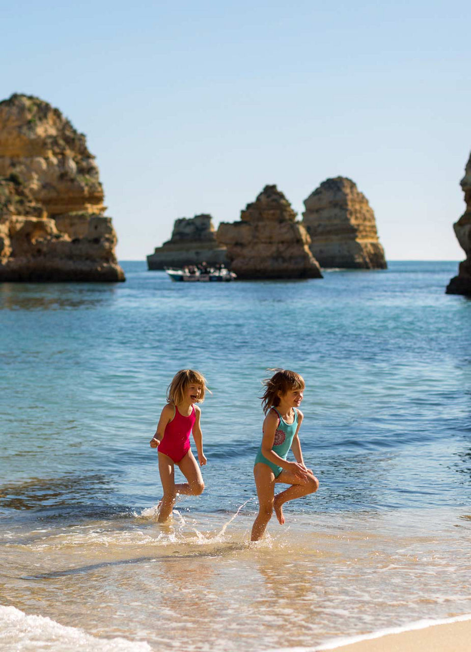 Children running through water