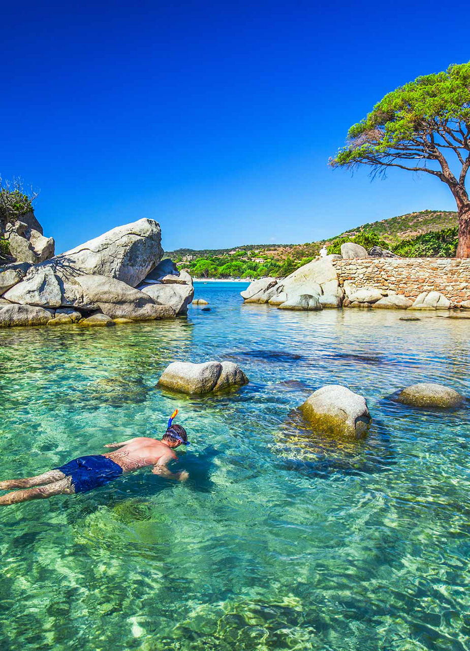 Young man snorkeling at Palombaggia 