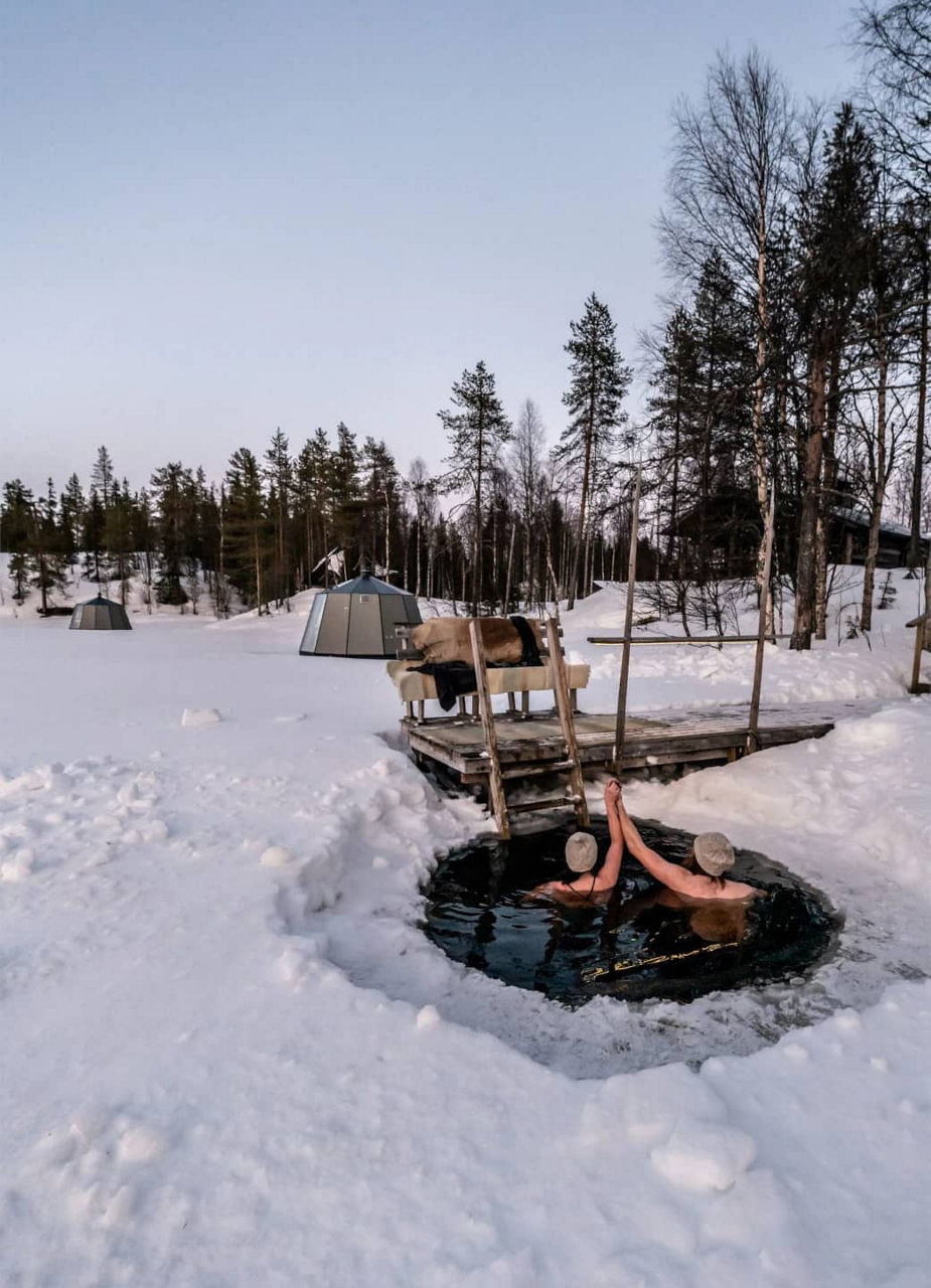 People taking a dip in the ice cold lake