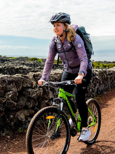 Mountain biking along black lava stones