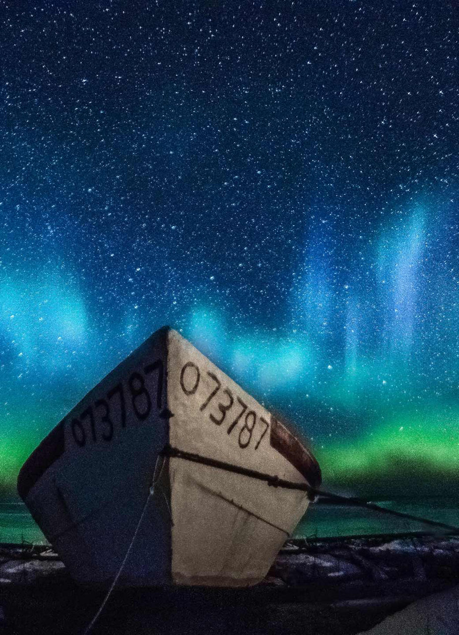 Fishing boat with the Aurora Borealis in the background