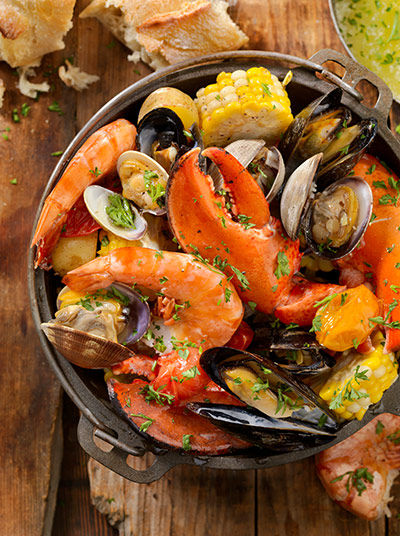 Seafood dish with lobster, prawns, mussels and vegetables